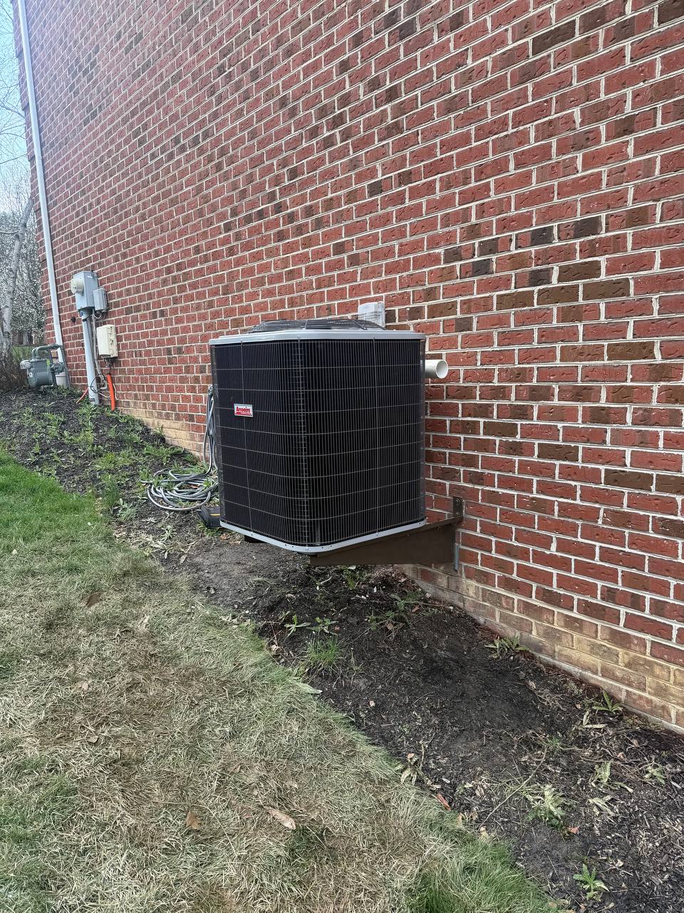 New AC condenser unit installed by HP Heating & Air on a Pittsburgh home